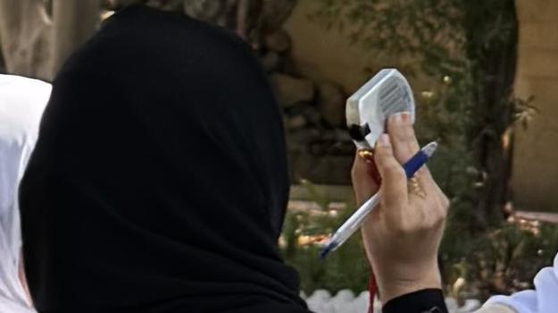 students doing land cover protocol, measuring slope angle