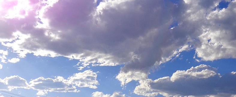 Clouds in the sky, with sunlight coming through.