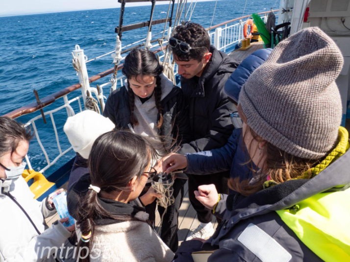 Students doing an experiment on the ship.