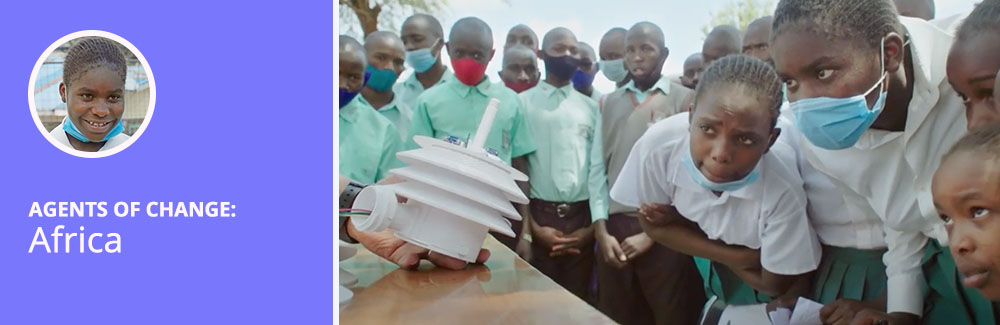 Several children in Africa watching someone explain a scientific instrument. Text reads: Agents of Change: Africa.