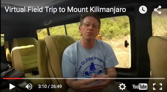 A screen grab of a video which show a man sitting inside a van.