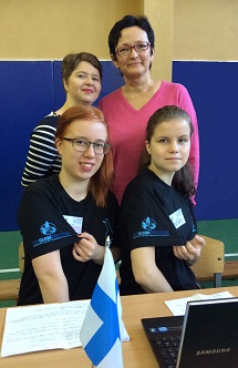 Four women pose for a photo.