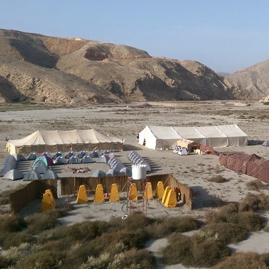 A campsite is seen among hills.