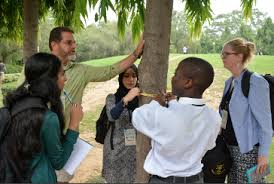 GISN members in the field with students