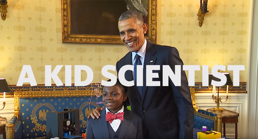 President Obama poses with a student at a science fair.