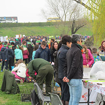 Many students and teachers are seen from a distance for an educational event.