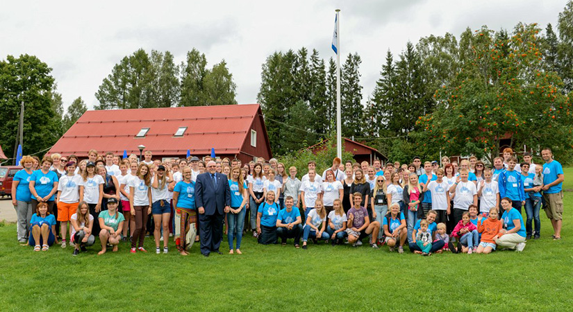 A large group poses for the photo.