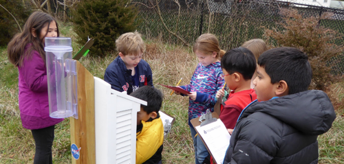 Students collecting and writing data down.