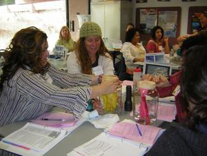 Teachers sitting on tables.