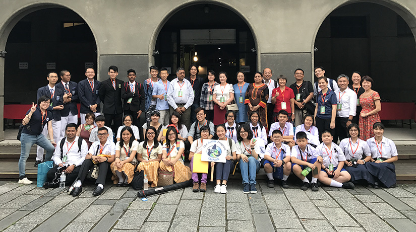 A large group of people pose for a photo.