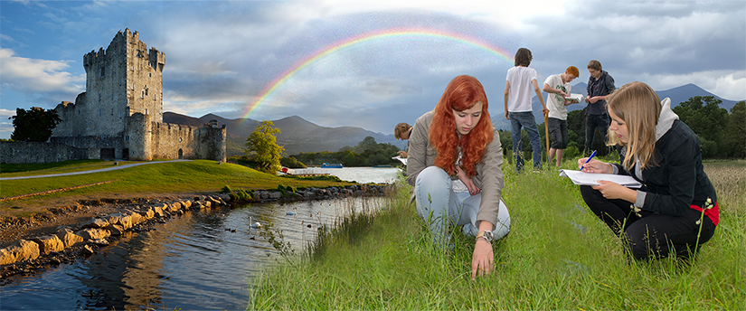 An image of several people conducting research in a grassy outside area. There is a river behind them and a stone building in the distance.