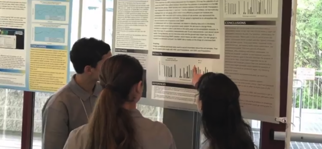 Students at a science poster presentation