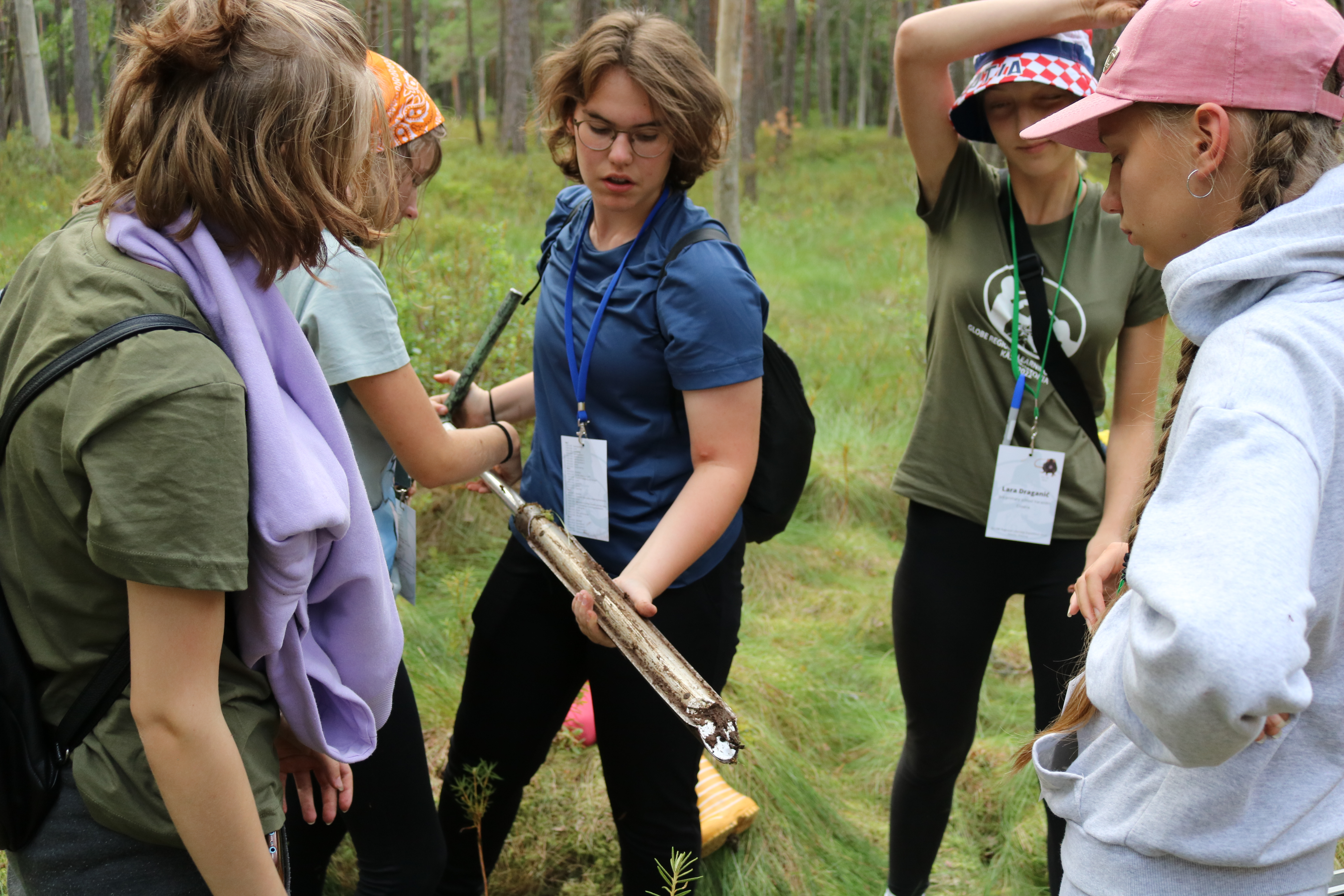 Students studying soil and conducting relevant fieldwork on Day Two