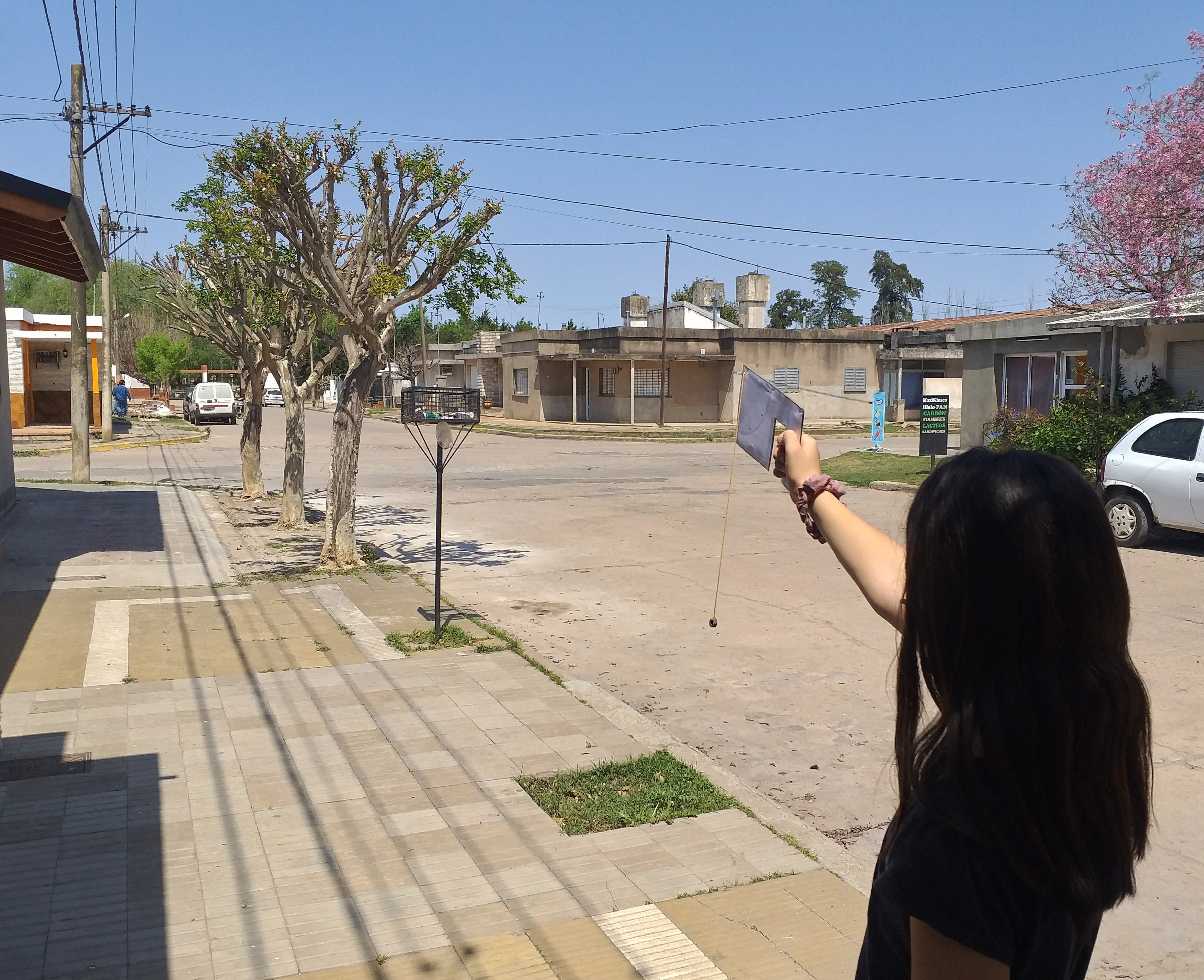 A female student of the Private Elementary School Incorporated No. 1345 Nuestra Señora del Carmen measuring tree data