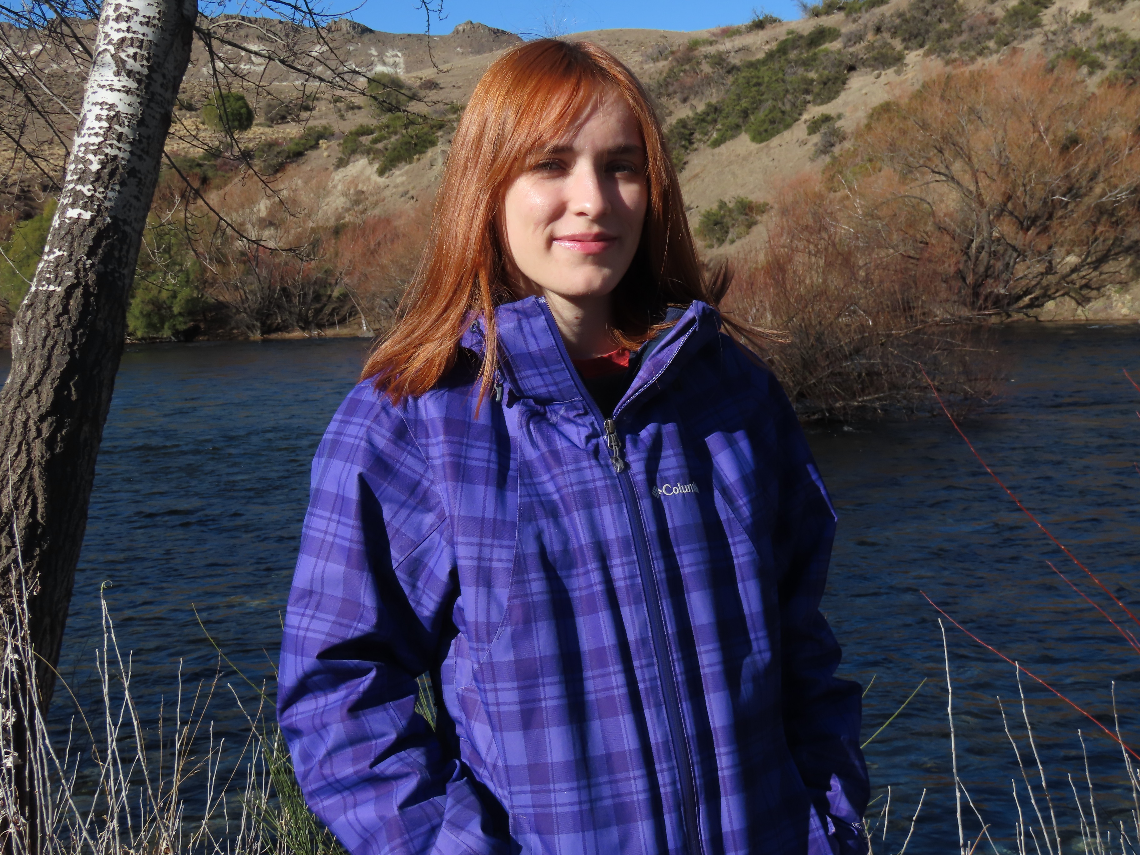 Photo of Marianela, standing outside by a lake