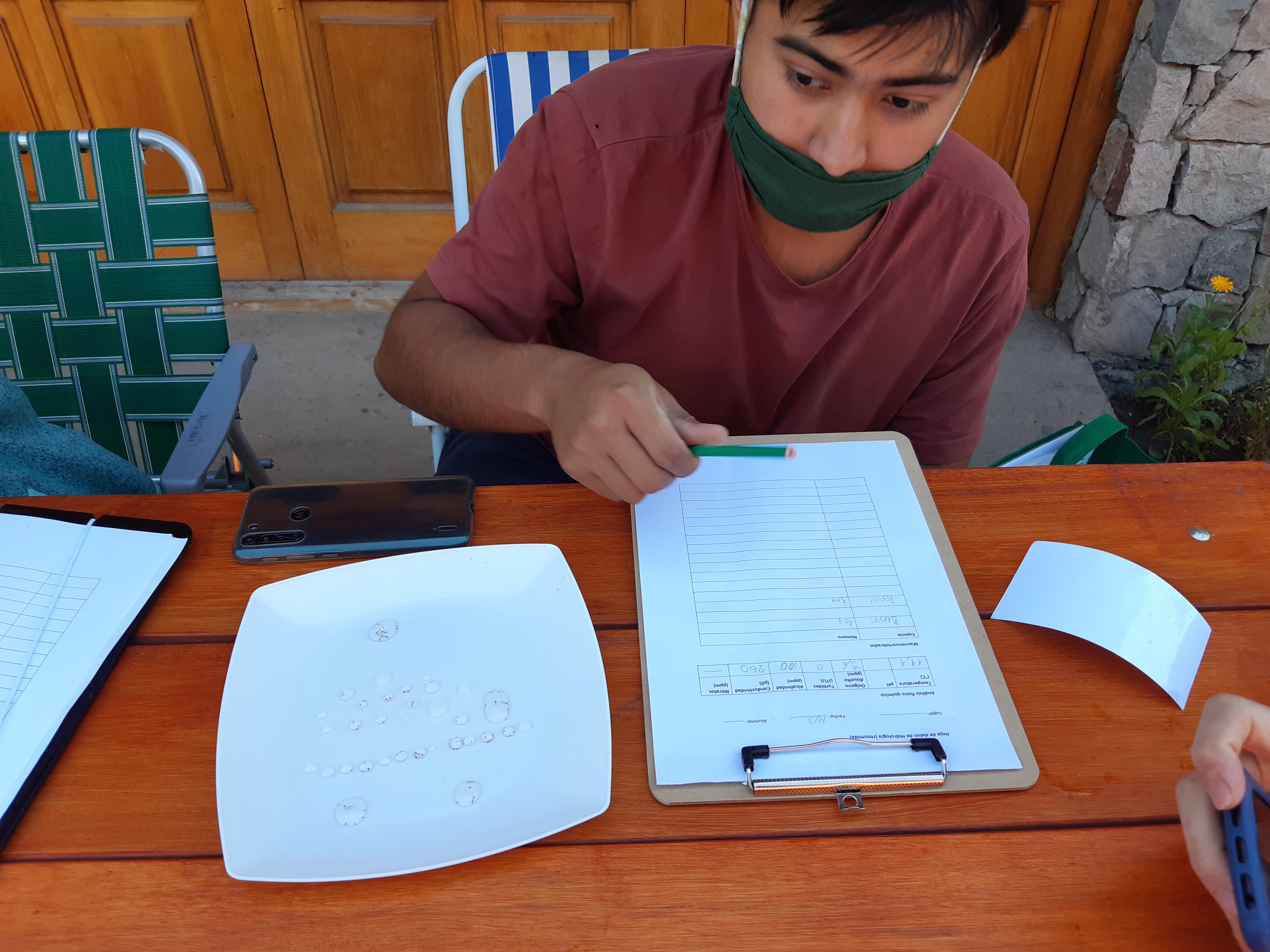 Photo of Lucio working at an outdoor table