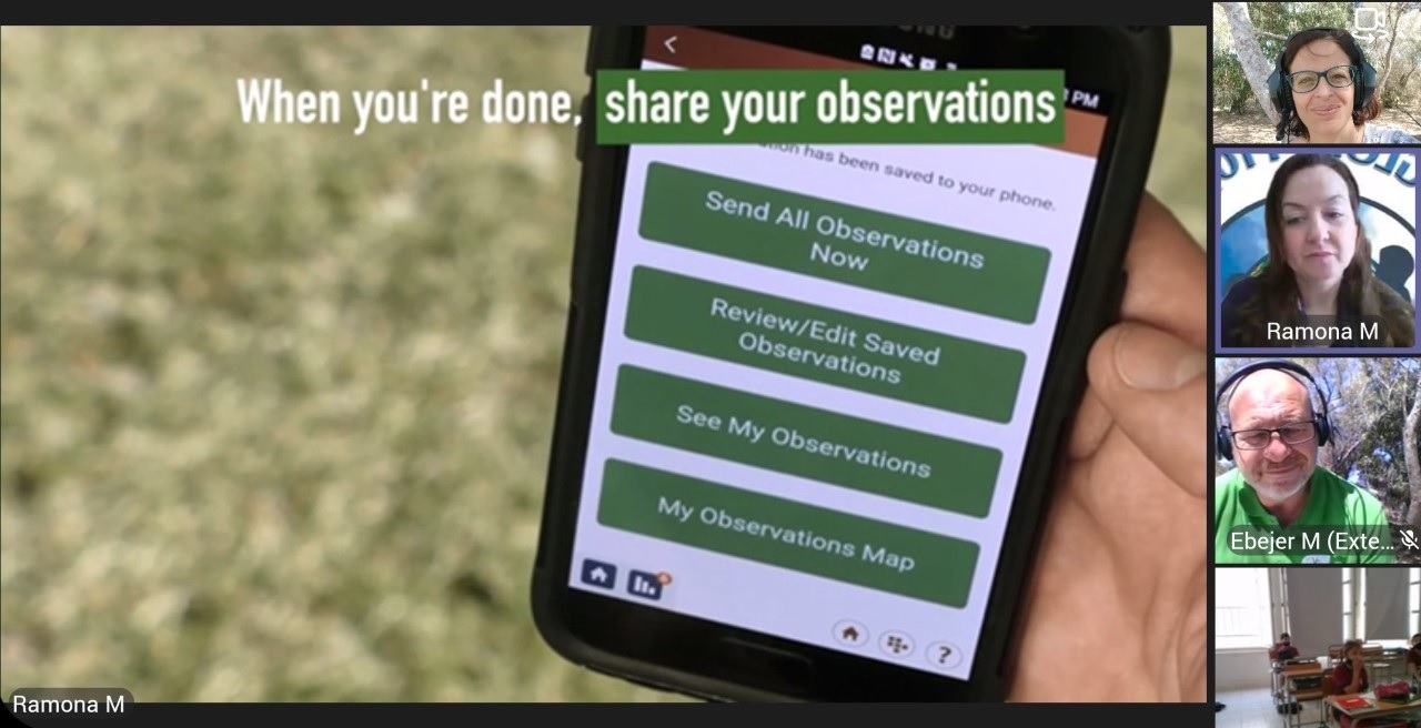 Photo of a phone with the GLOBE Observer app showing