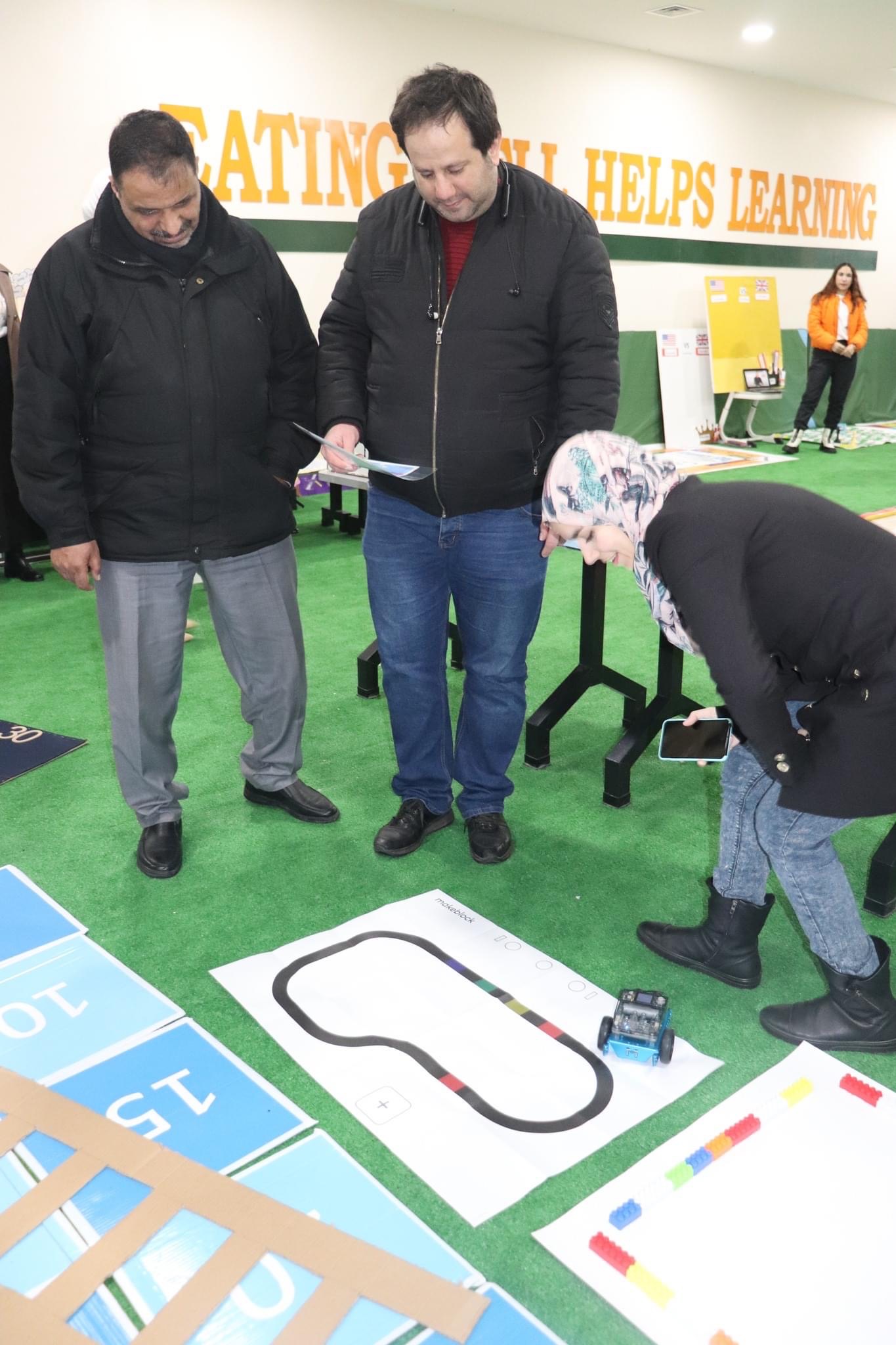 Mrs. Noor explains how to implement robot in education and integrated robotics with science for Mr. Fawas and Mr. Hase  