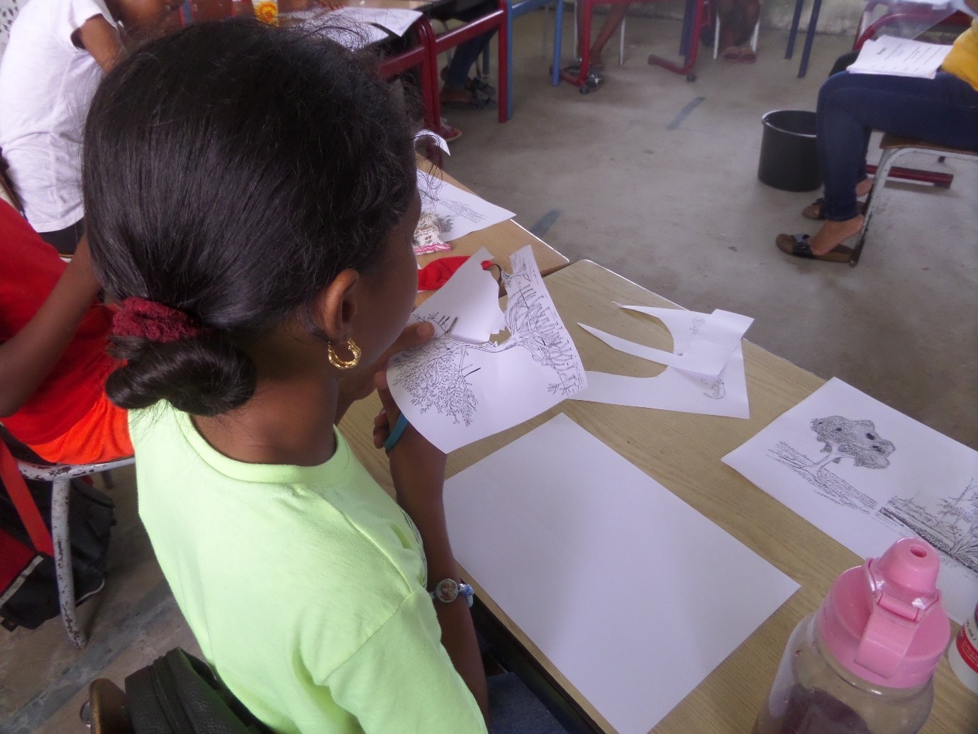 GLOBE Suriname student engaged in a summer vacation activity in the classroom
