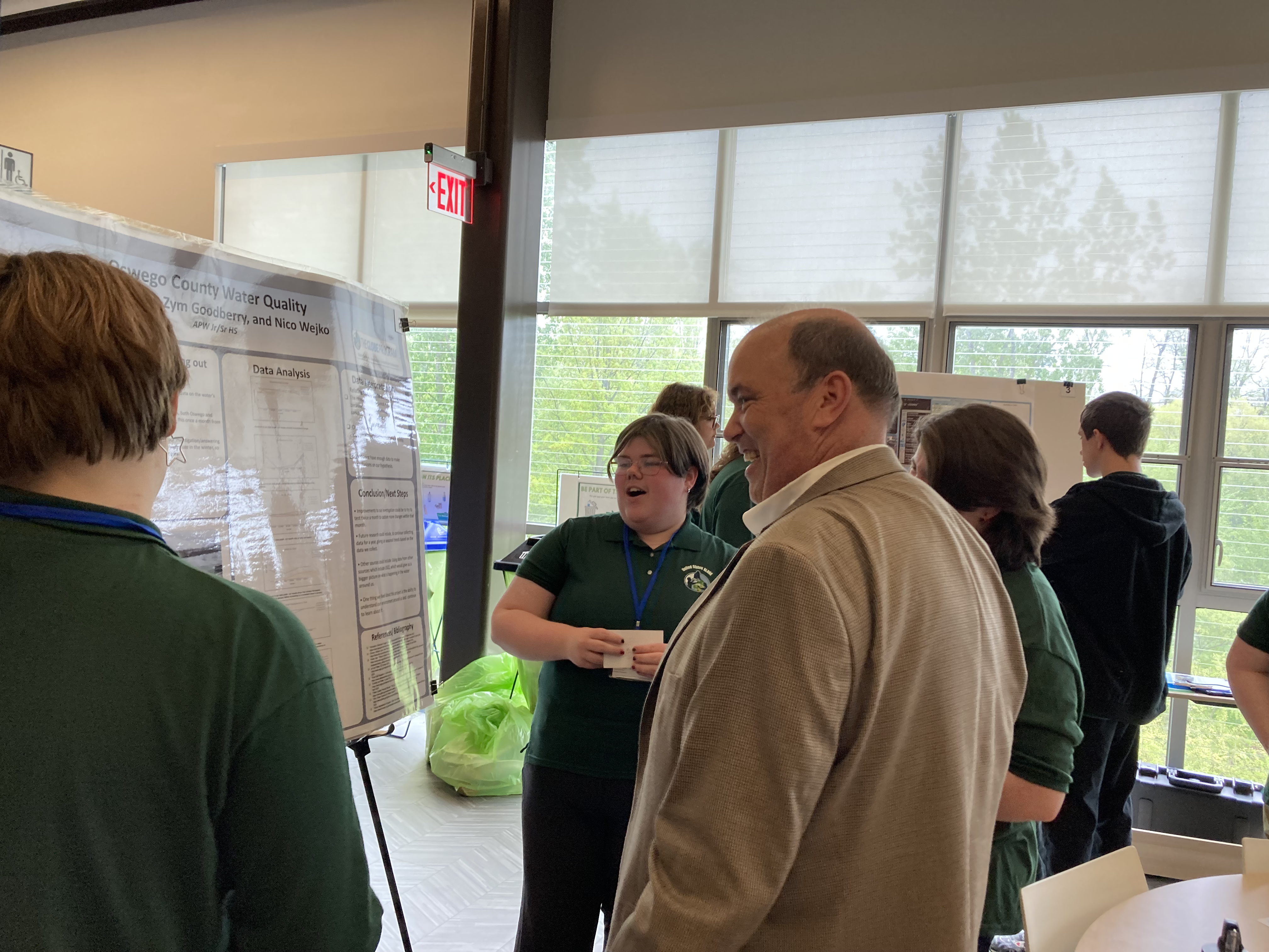 Students presenting their work during the symposium.