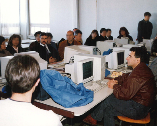 Group of people in front of computers.
