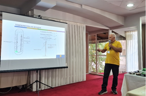 Man on stage presenting GLOBE protocols.