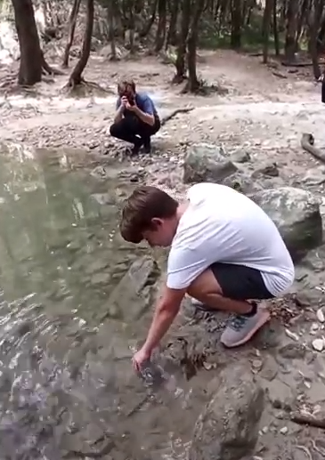 Students taking readings at a creek