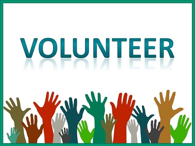 Graphic with many diverse hands up, that reads "Volunteer"