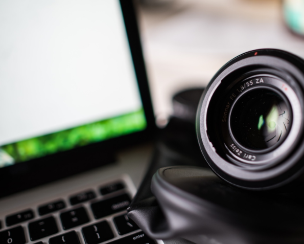 Photo of a camera and a computer