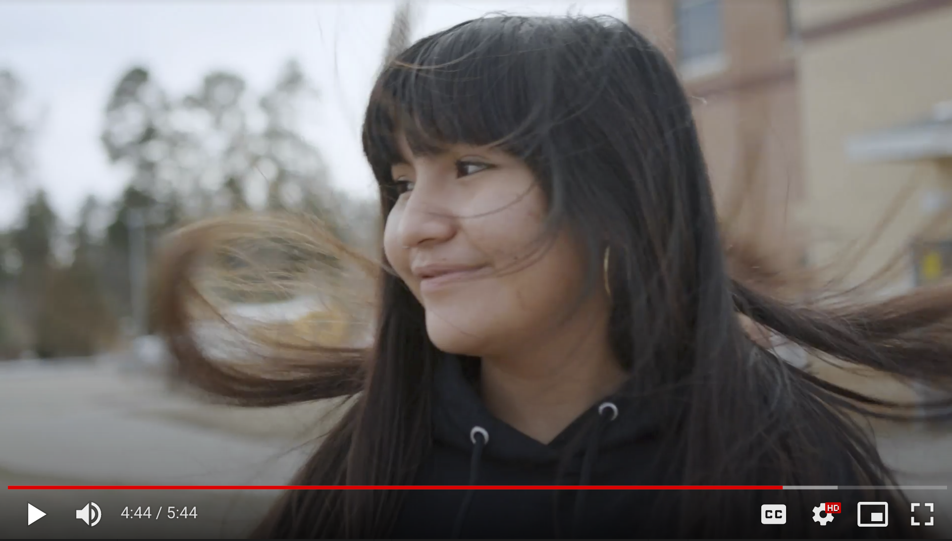 Photo taken from "Agents of Change, Episode 3: GLOBE in North America (United States); showing a student from the Mescalero Apache Reservation High School with a huge smile on her face