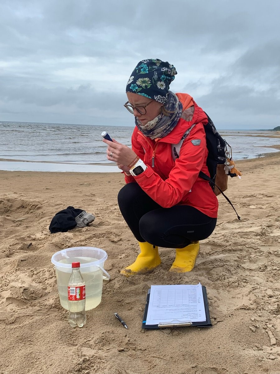 Photo of a GLOBE community member working on a GLOBE project; on the beach