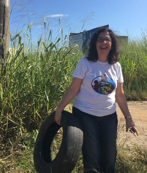 Photo of Inez Mauad, citizen scientist and educator, from GLOBE Brazil, documented a tire breeding site and eliminated it from use. 