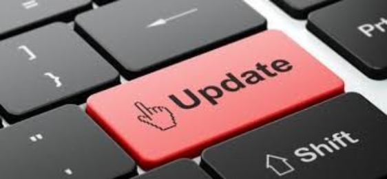 A photo of a computer keyboard with a key that reads "Update" highlighted