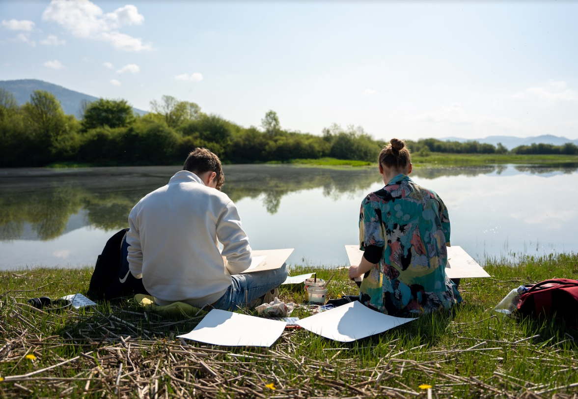 GLOBE students in action, working on research near a lake