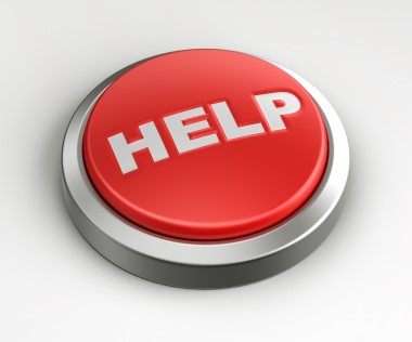 A photo of a button that reads "Help"