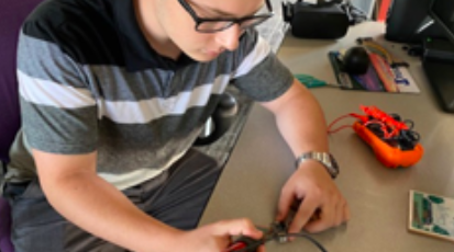 Student works on a CubeSat