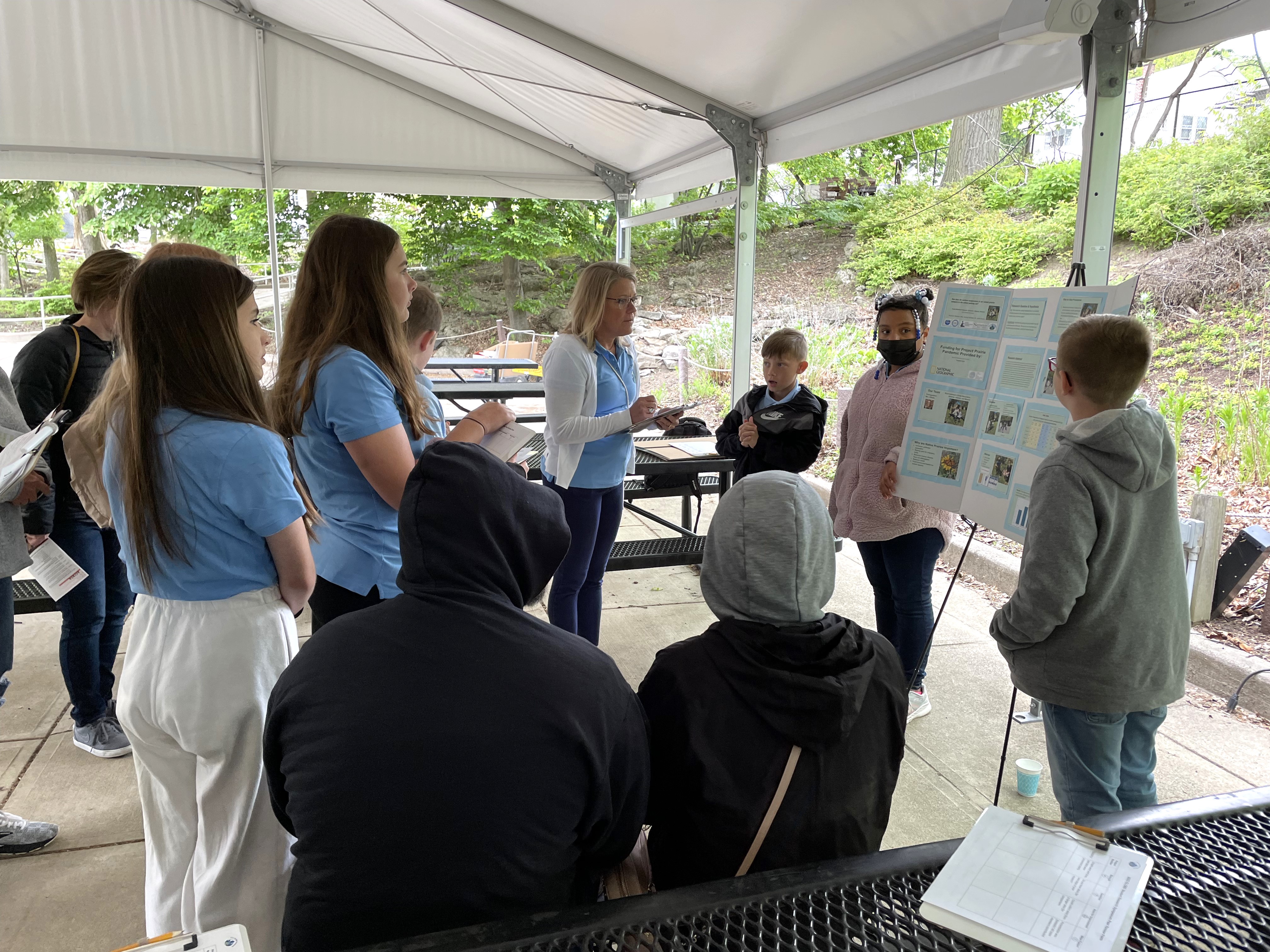students present their research at the Toledo Zoo student research symposium