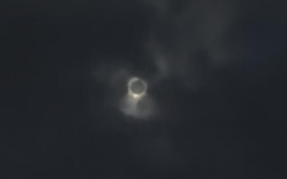the eclipse was visible through the clouds at Niagara Falls