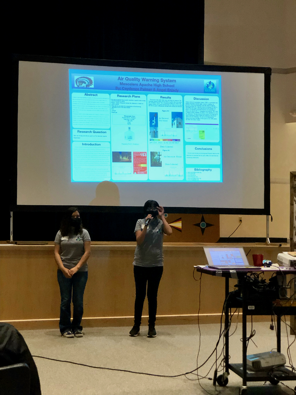 two students present their research at the Mescalero Apache School student research symposium