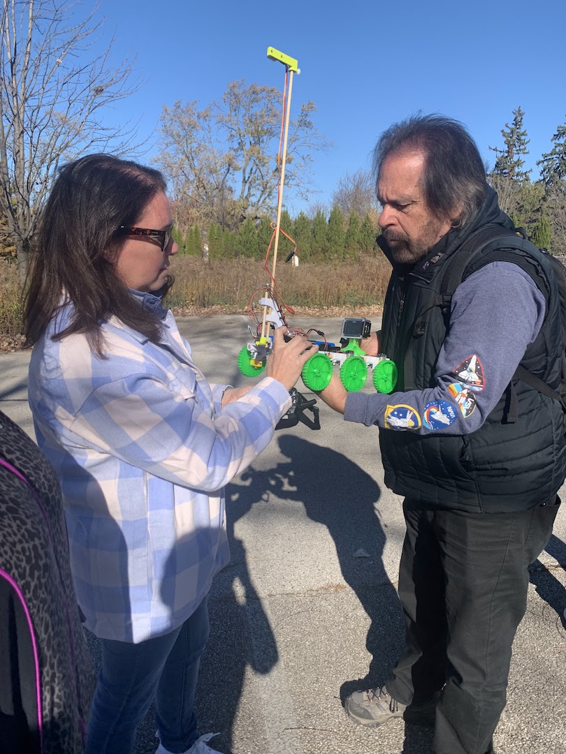 a participant learns to set up the TerraROVER to collect air and surface temperatures and humidity