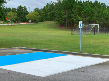 The parking lot was painted with blue and white sections at Longleaf Middle School to aid students in their surface temperature investigation