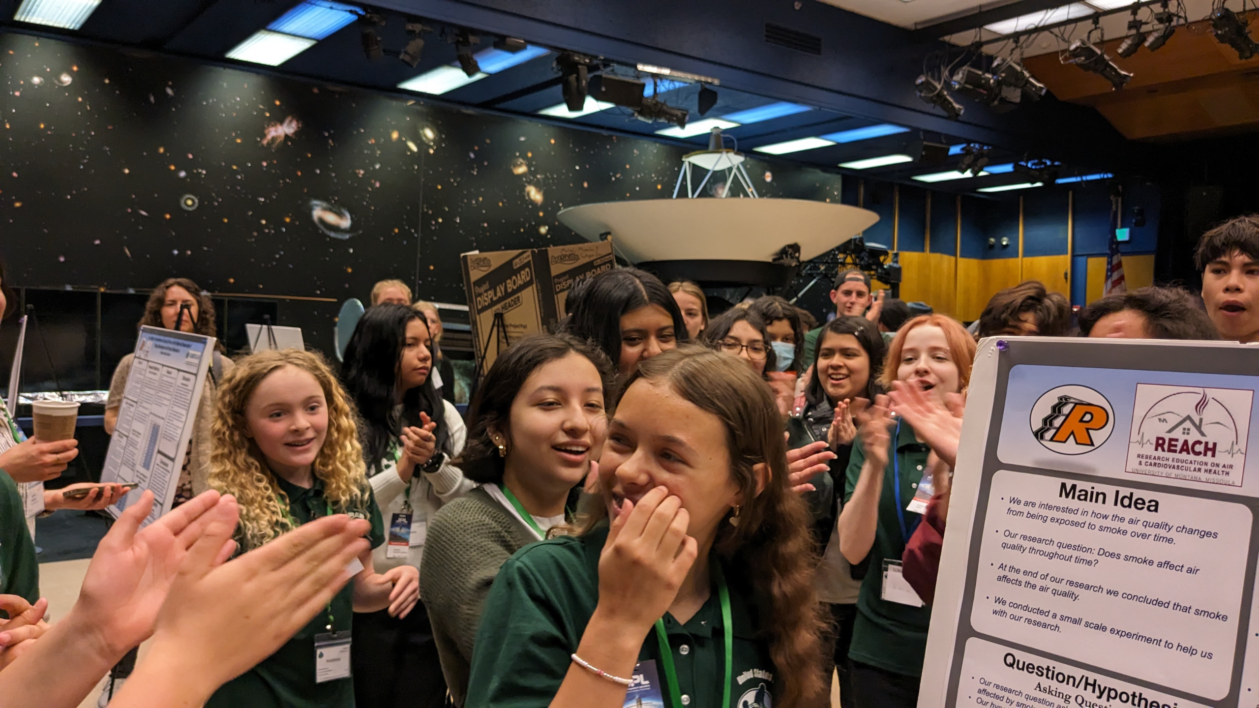 Students cheered and clapped as they participated in an ice breaker on day 1 at the Pacific Region Student Research Symposium