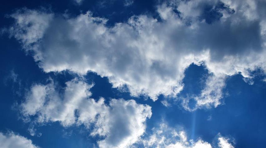 cumulus clouds against a blue sky