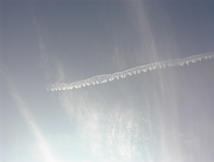 Persistent Spreading Contrail under Cirrostratus Veil