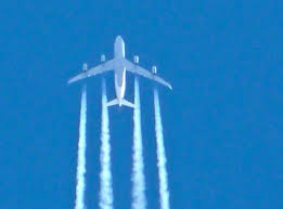image of jet with contrails