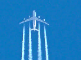 image of jet with contrails