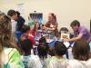 NASA Langley hosted a youth day on August 2nd, 2016. Here, a group of intrigued youth gather around a demonstration of NASA's CALIPSO, a satellite that gives valuable insight into the role that clouds and atmospheric aerosols (airborne particles) play in regulating Earth's climate.