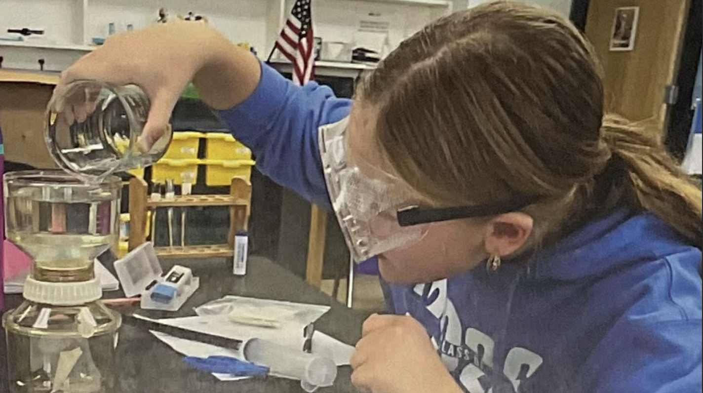 Researcher preparing sample for microplastic analysis (media release form is on file)