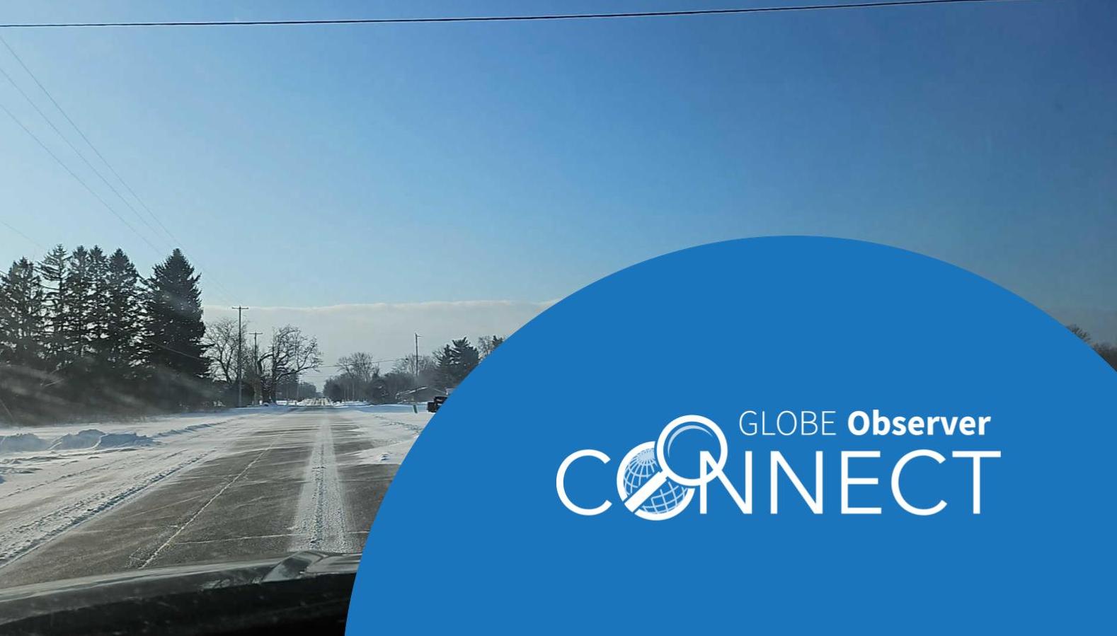 Dashboard cam view of a roadway with blowing snow (photo by Ed Szoke) Text says GLOBE Observer Connect 26 March 2026