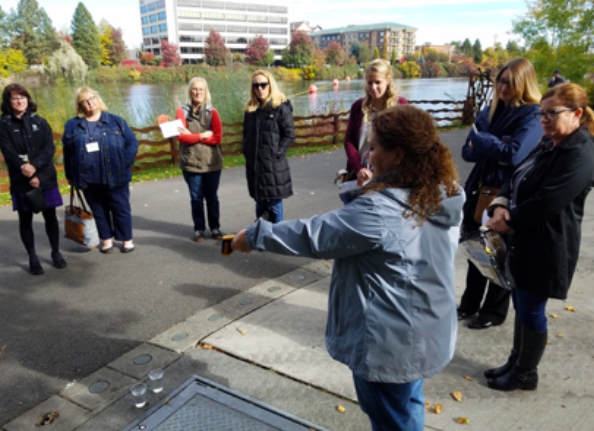 Jennifer Hammonds demonstrates the surface temperature protocol at the GLOBE-Eco-Schools USA workshop during the 2018 NAAEE conference.